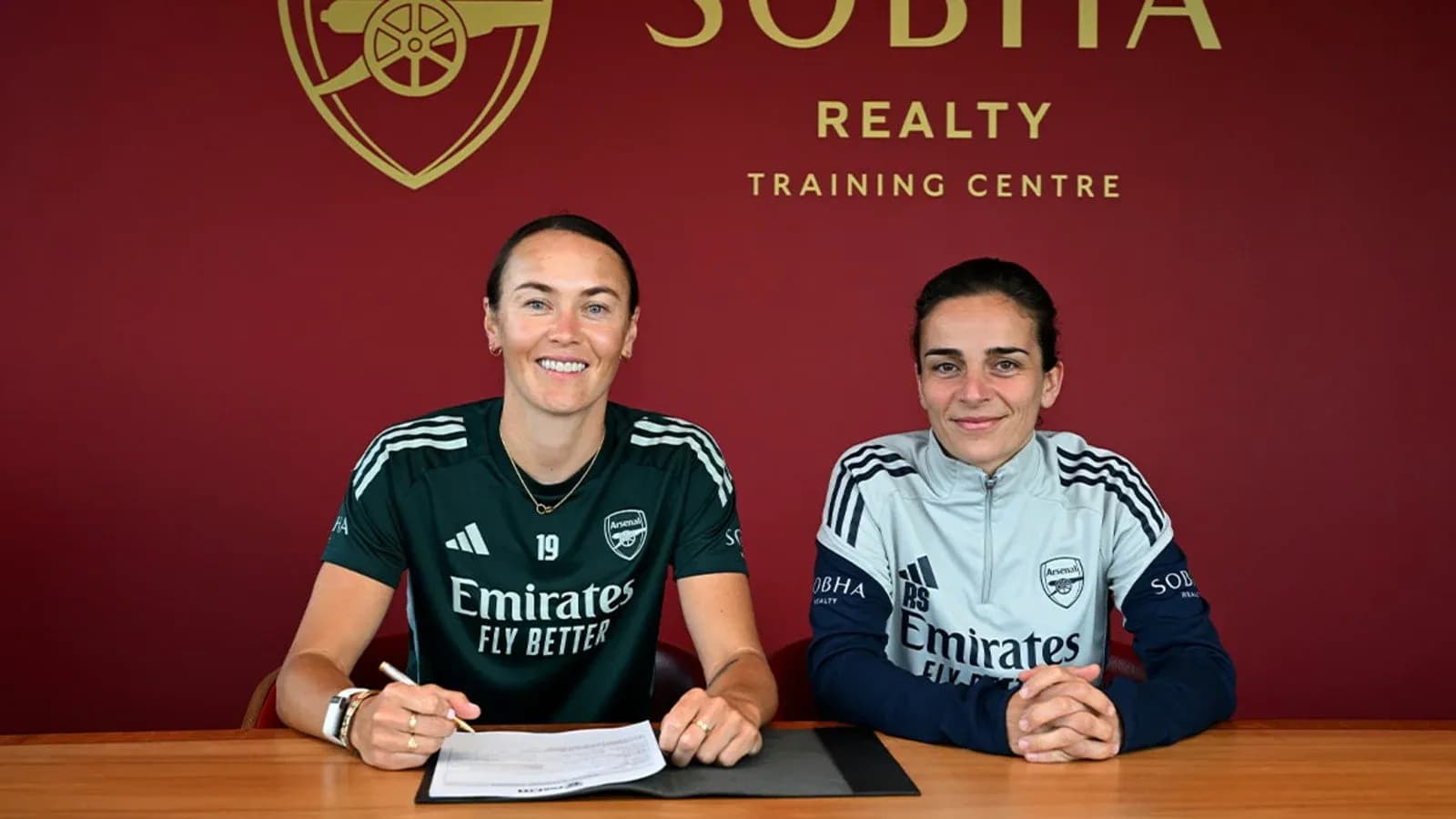 Players signing contract at Arsenal training center Players signing contract at Arsenal training center