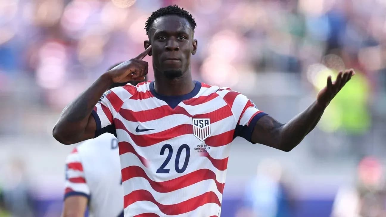 Player celebrating during a USA soccer match Player celebrating during a USA soccer match