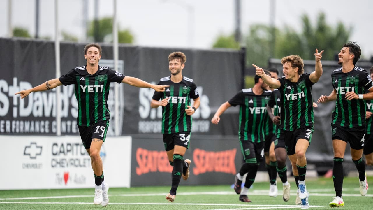 Austin II players celebrating a goal Austin II players celebrating a goal