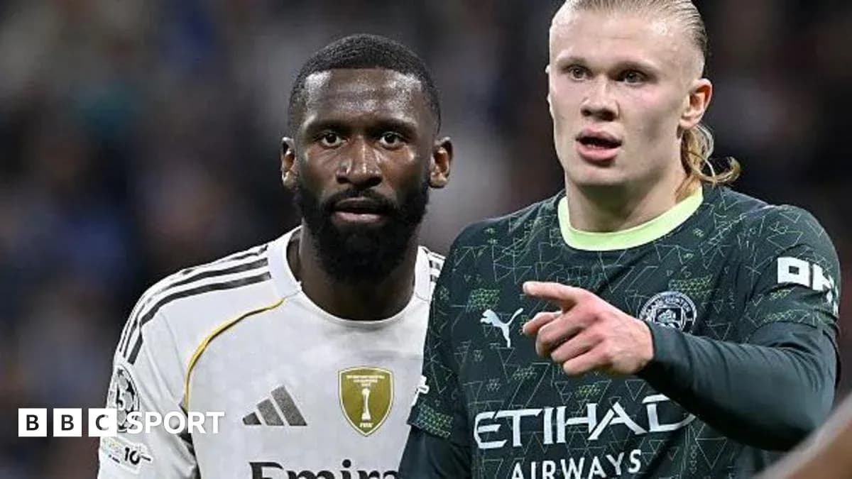 Two football players during a match, one pointing Two football players during a match, one pointing