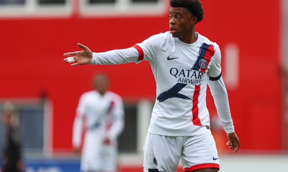 Player gesturing during match in PSG kit Player gesturing during match in PSG kit