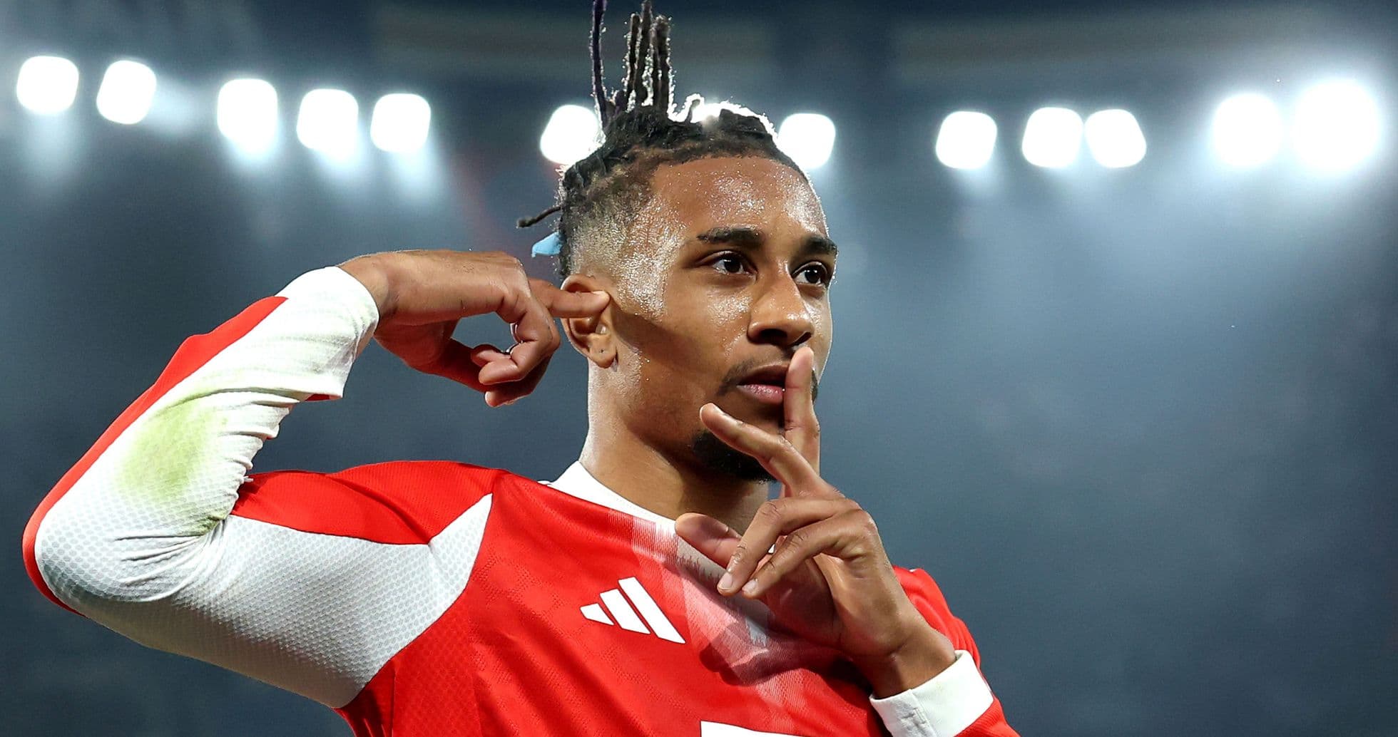 Player celebrating with a finger gesture after scoring Player celebrating with a finger gesture after scoring