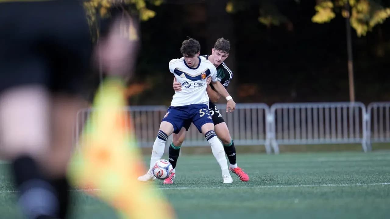 Real Monarchs player battling for the ball Real Monarchs player battling for the ball