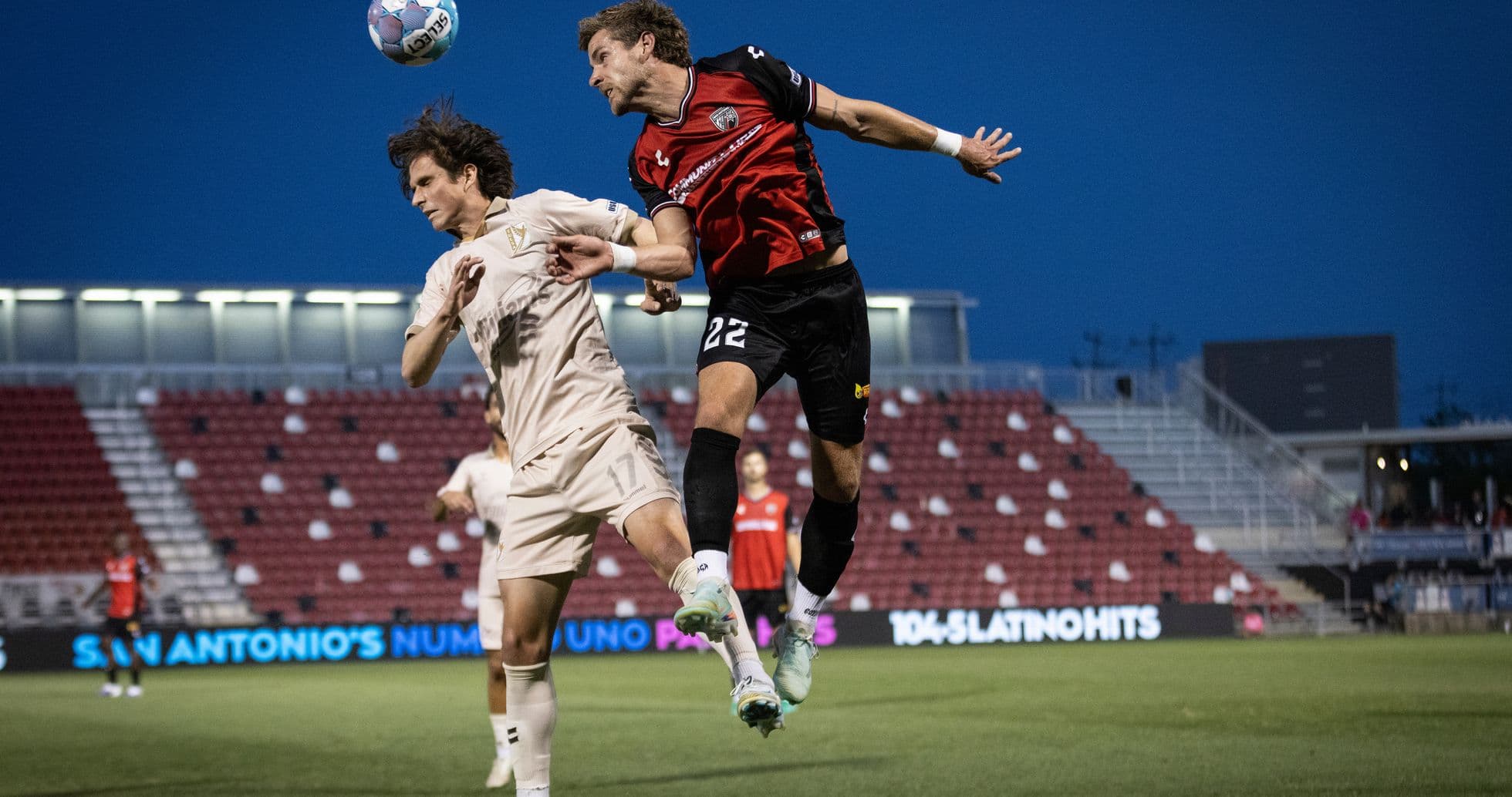 Players contesting a header during FC Tulsa match Players contesting a header during FC Tulsa match