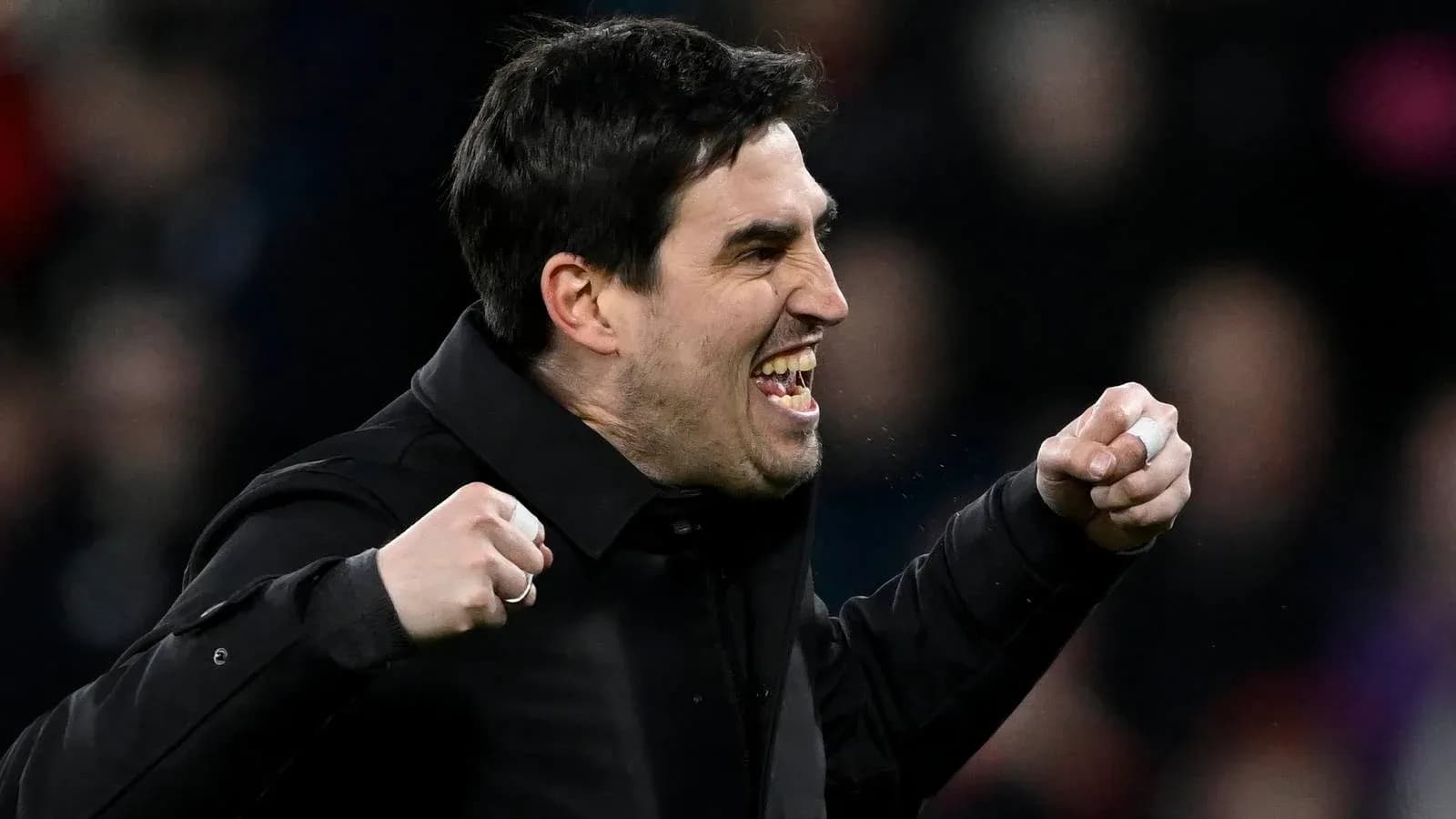 Coach celebrating passionately during match Coach celebrating passionately during match