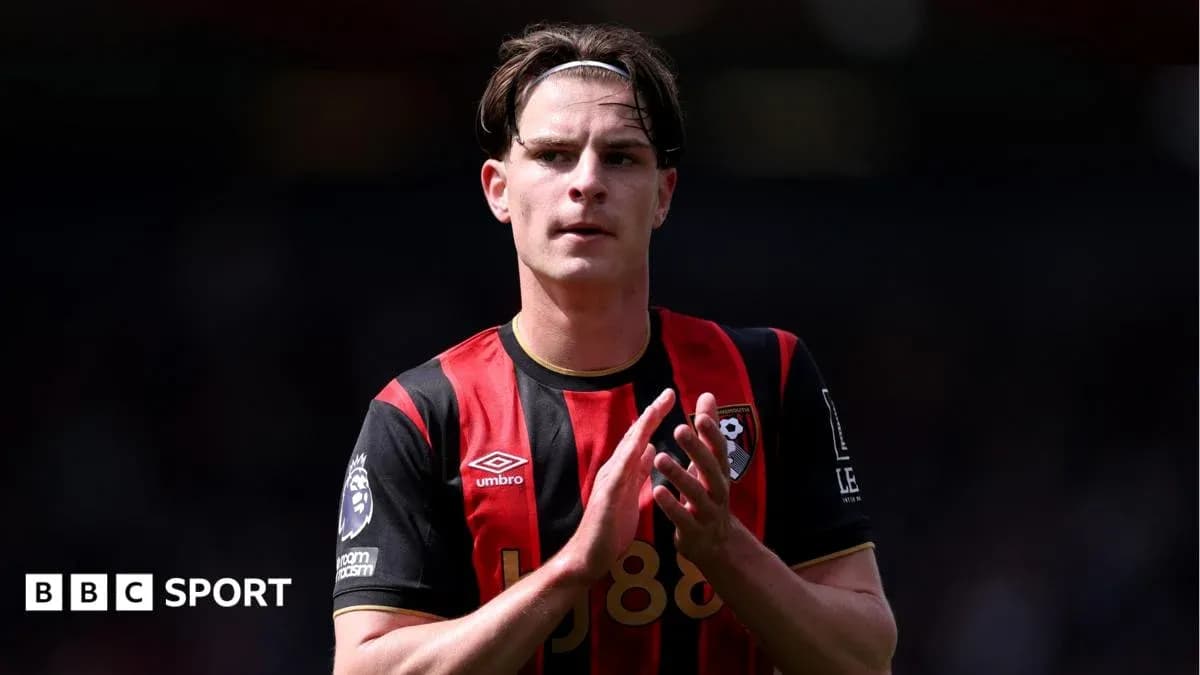 Bournemouth player applauding fans on the pitch Bournemouth player applauding fans on the pitch