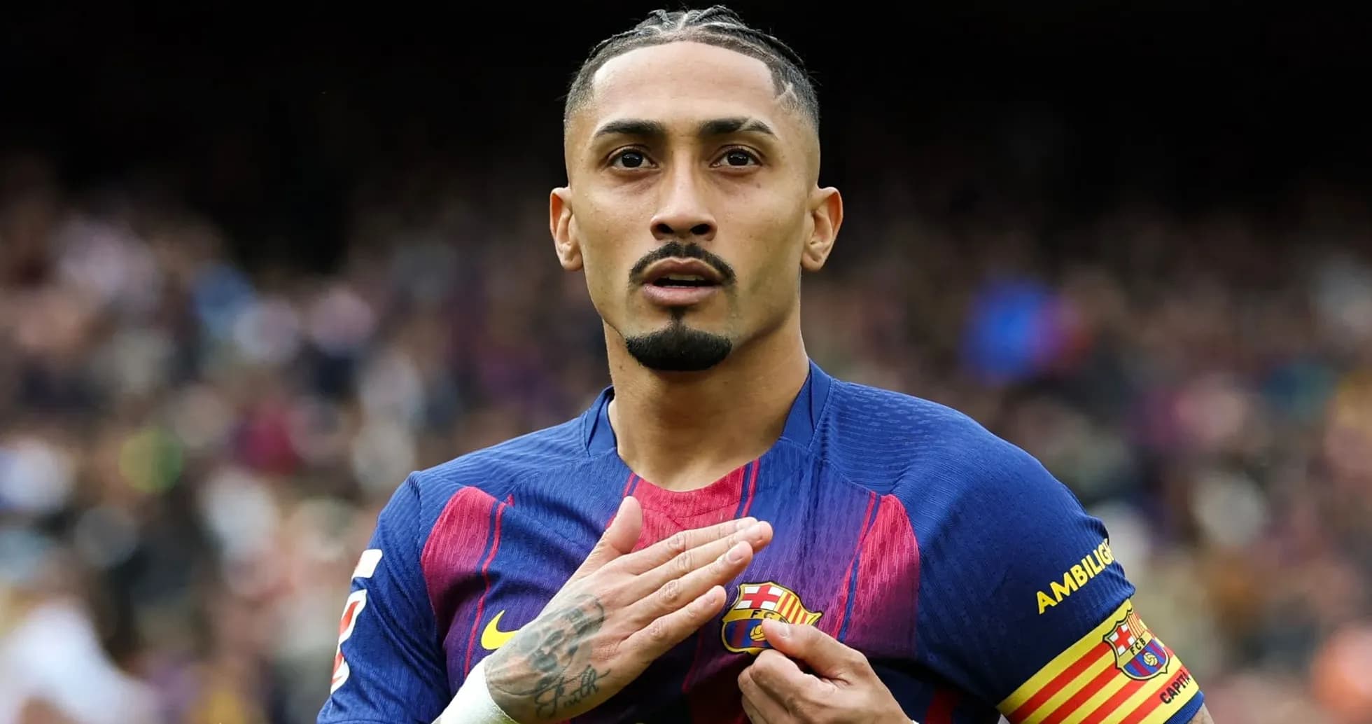 Player celebrating while touching FC Barcelona badge Player celebrating while touching FC Barcelona badge
