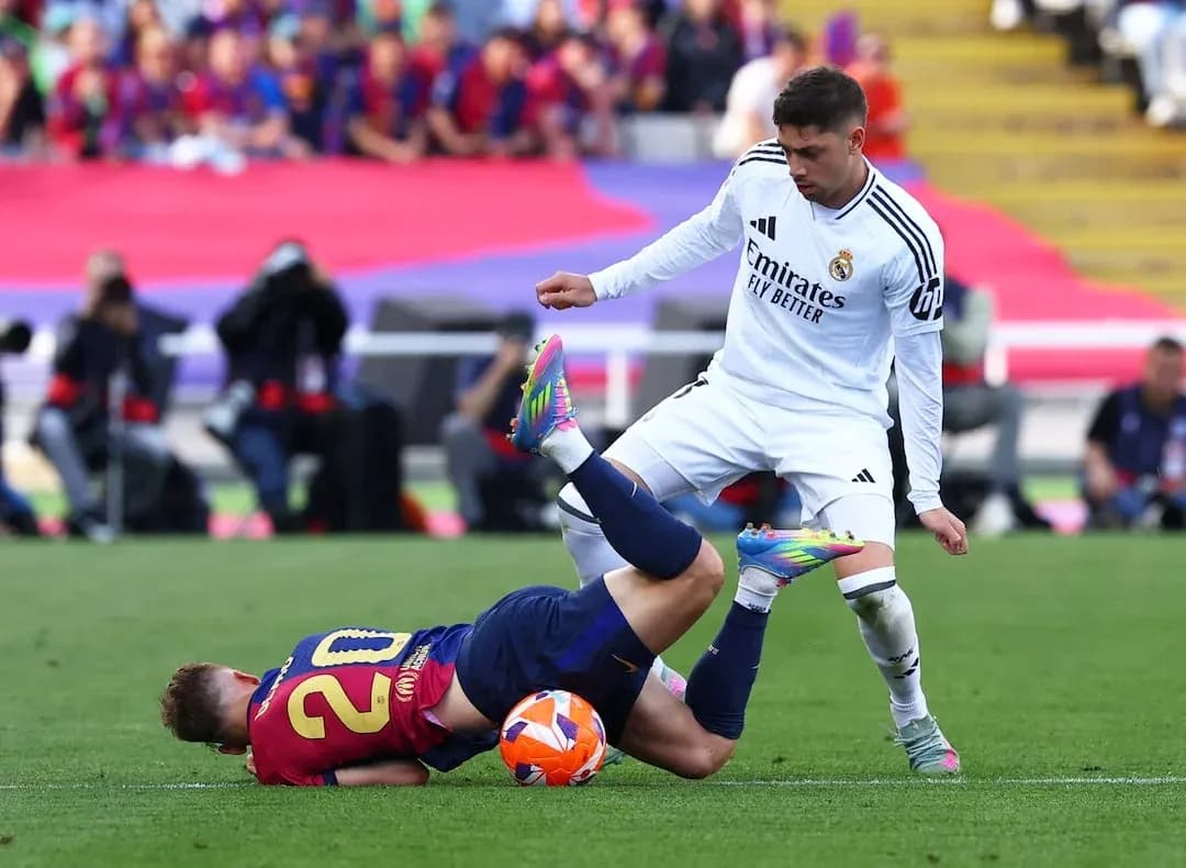 Barcelona player falling during El Clasico match Barcelona player falling during El Clasico match