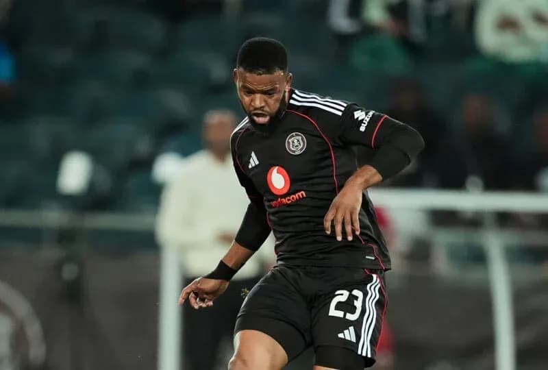 Player in black jersey during football match Player in black jersey during football match