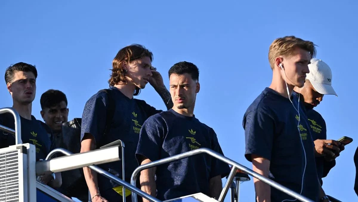 Players walking down steps in training attire Players walking down steps in training attire