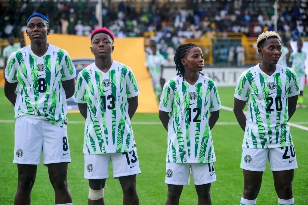 Four Nigerian players standing in uniform before match Four Nigerian players standing in uniform before match