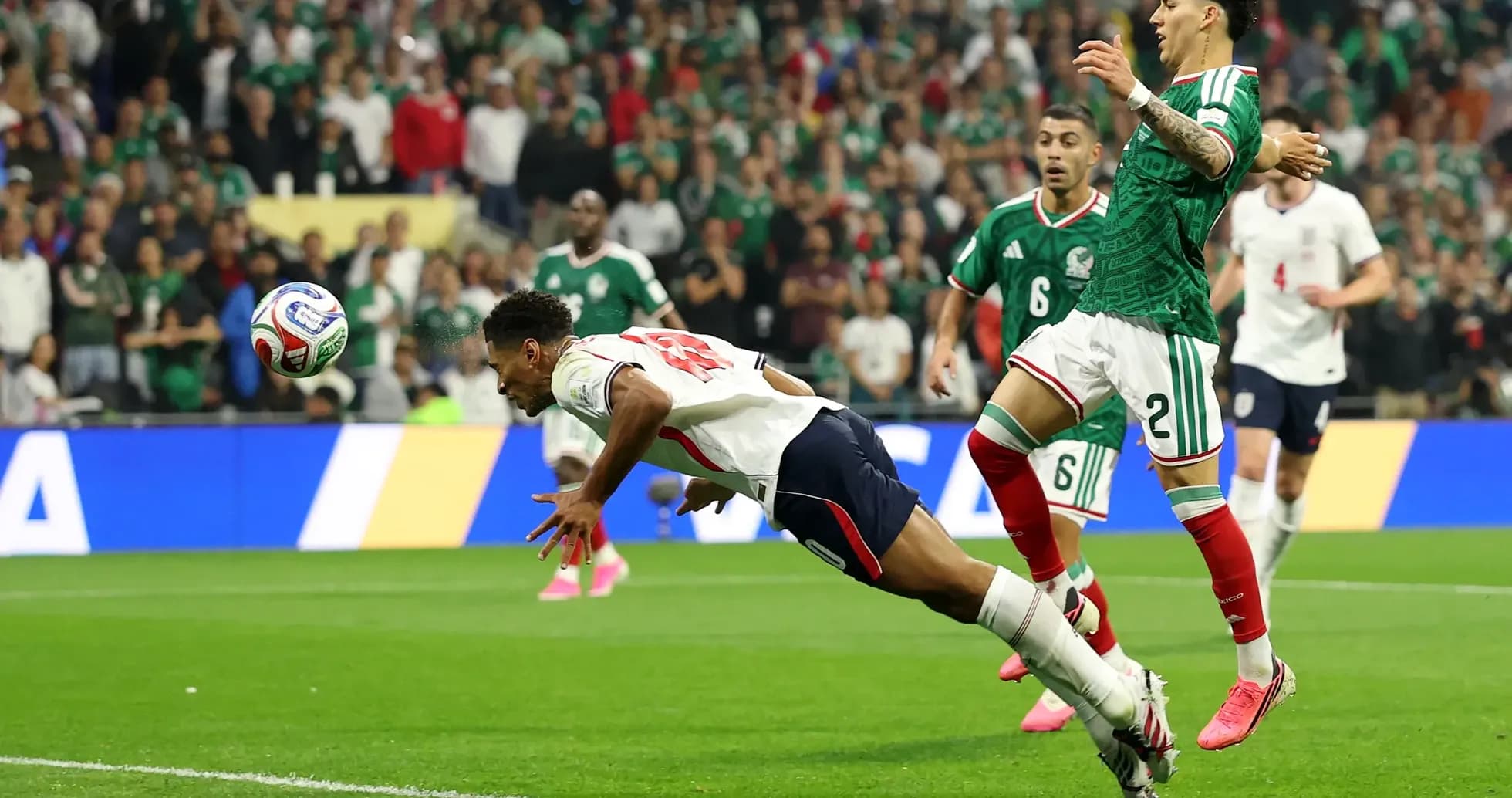 Player diving for the ball during Mexico vs England Player diving for the ball during Mexico vs England
