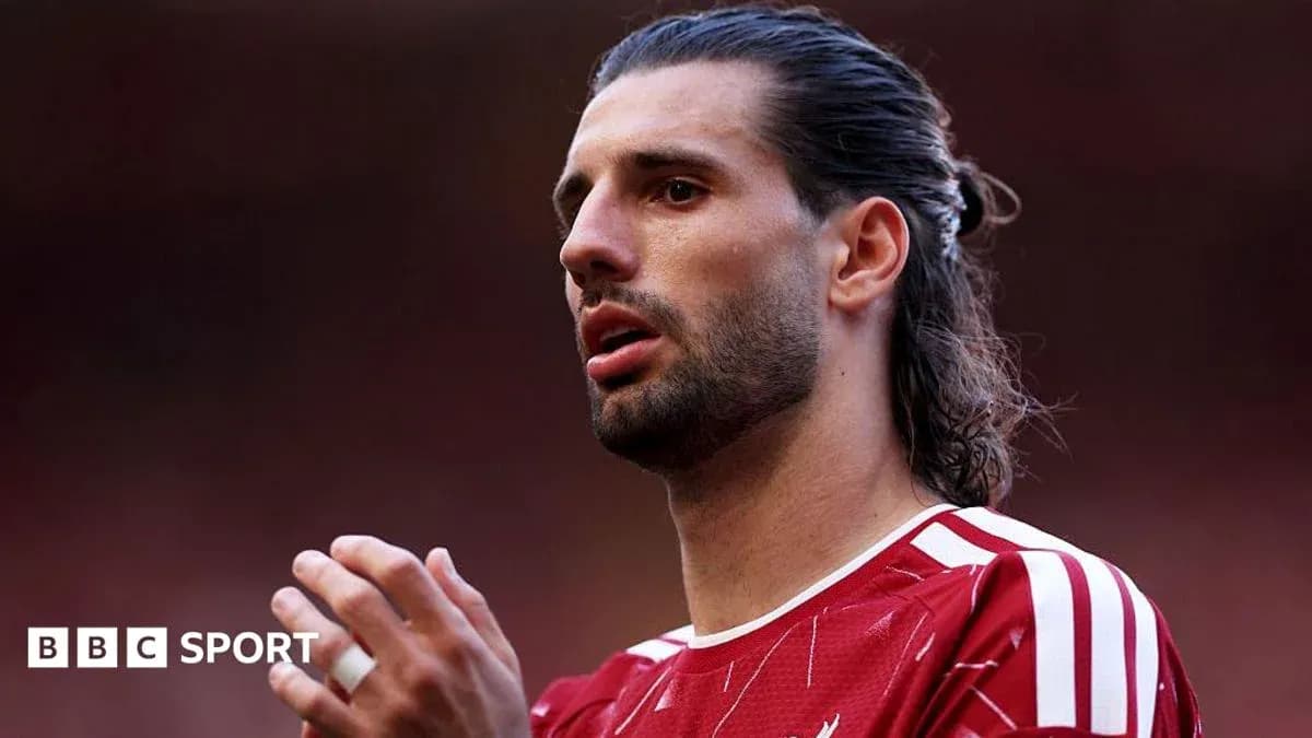 Player in red jersey gesturing during match Player in red jersey gesturing during match