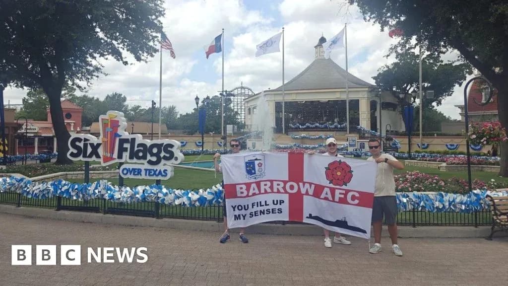 Two fans holding Barrow AFC flag at Six Flags Two fans holding Barrow AFC flag at Six Flags