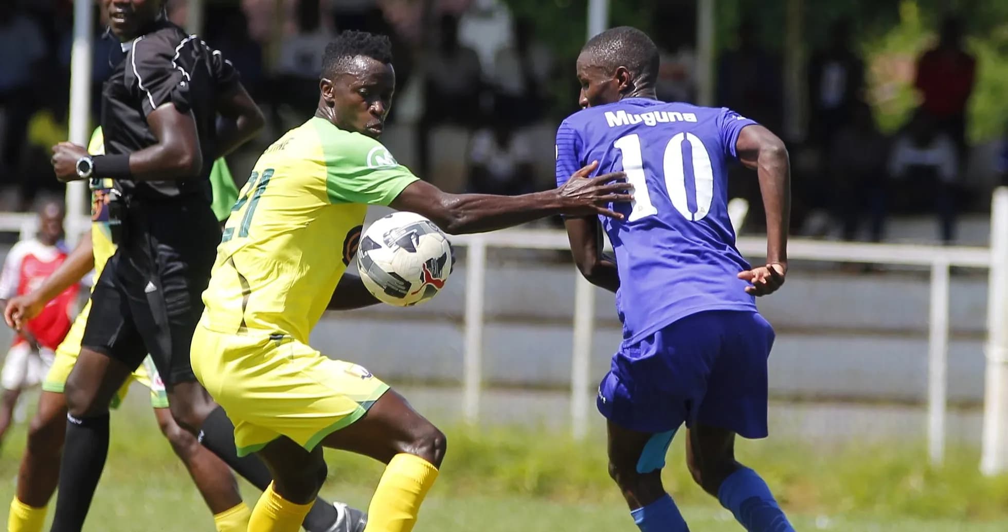 Player tackling opponent during Police vs Homeboyz match Player tackling opponent during Police vs Homeboyz match