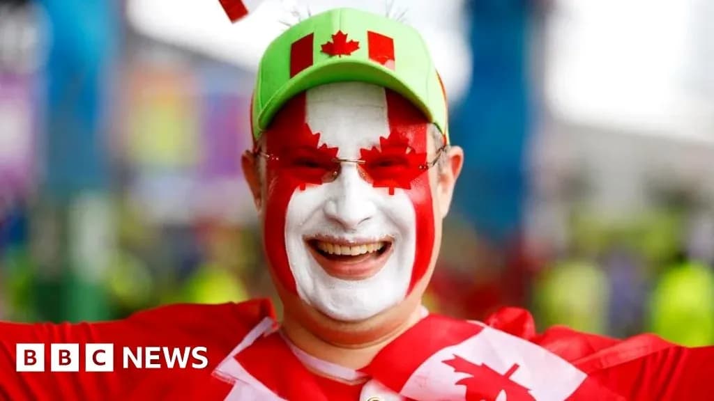 Fan with Canadian flag face paint celebrating Fan with Canadian flag face paint celebrating