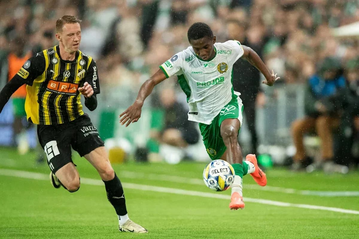 Player dribbling the ball while being chased Player dribbling the ball while being chased