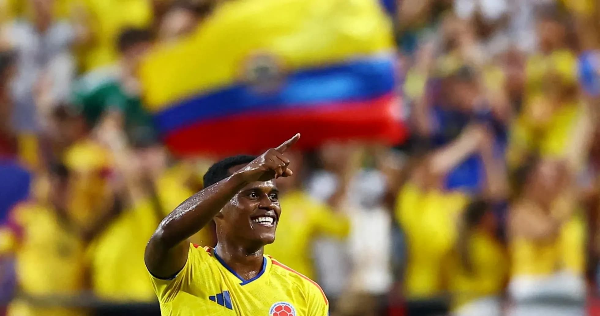 Player celebrating with fans in yellow jerseys Player celebrating with fans in yellow jerseys