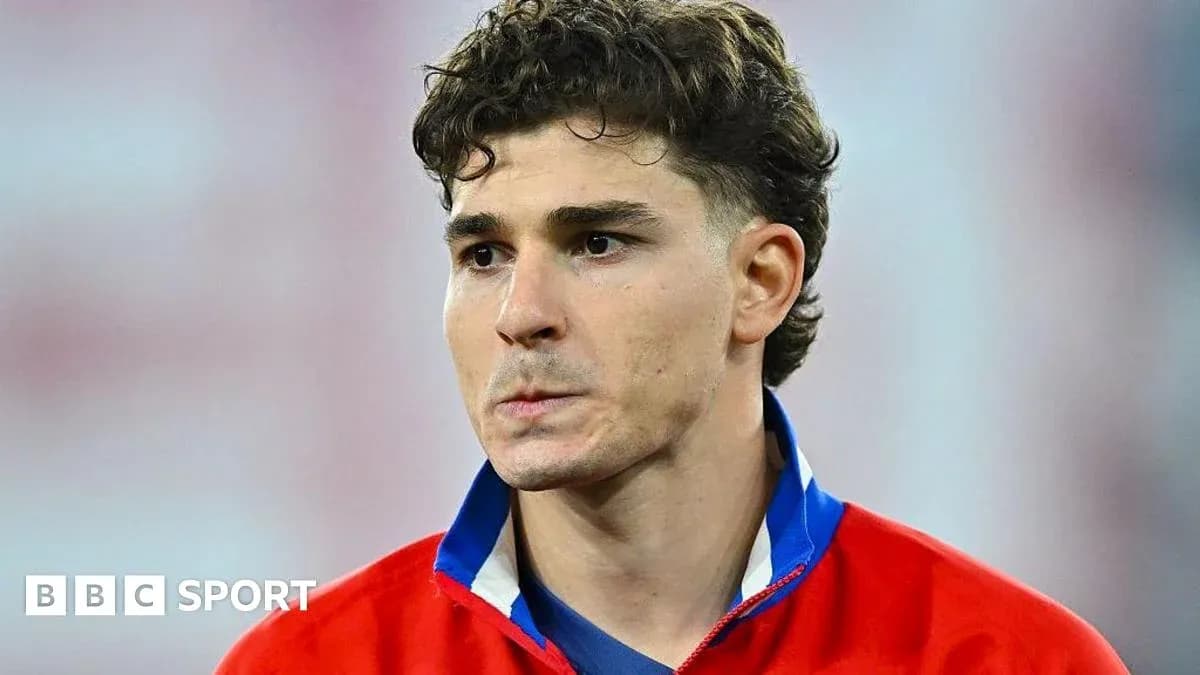 Player wearing a red jersey, looking serious Player wearing a red jersey, looking serious