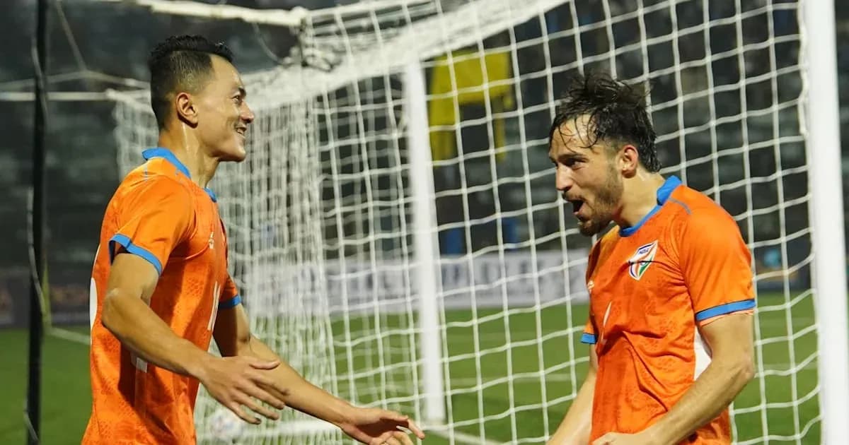 Two players celebrating a goal near the net Two players celebrating a goal near the net