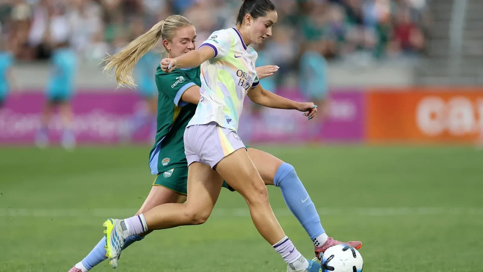 Orlando Pride player dribbling against Bay FC opponent Orlando Pride player dribbling against Bay FC opponent