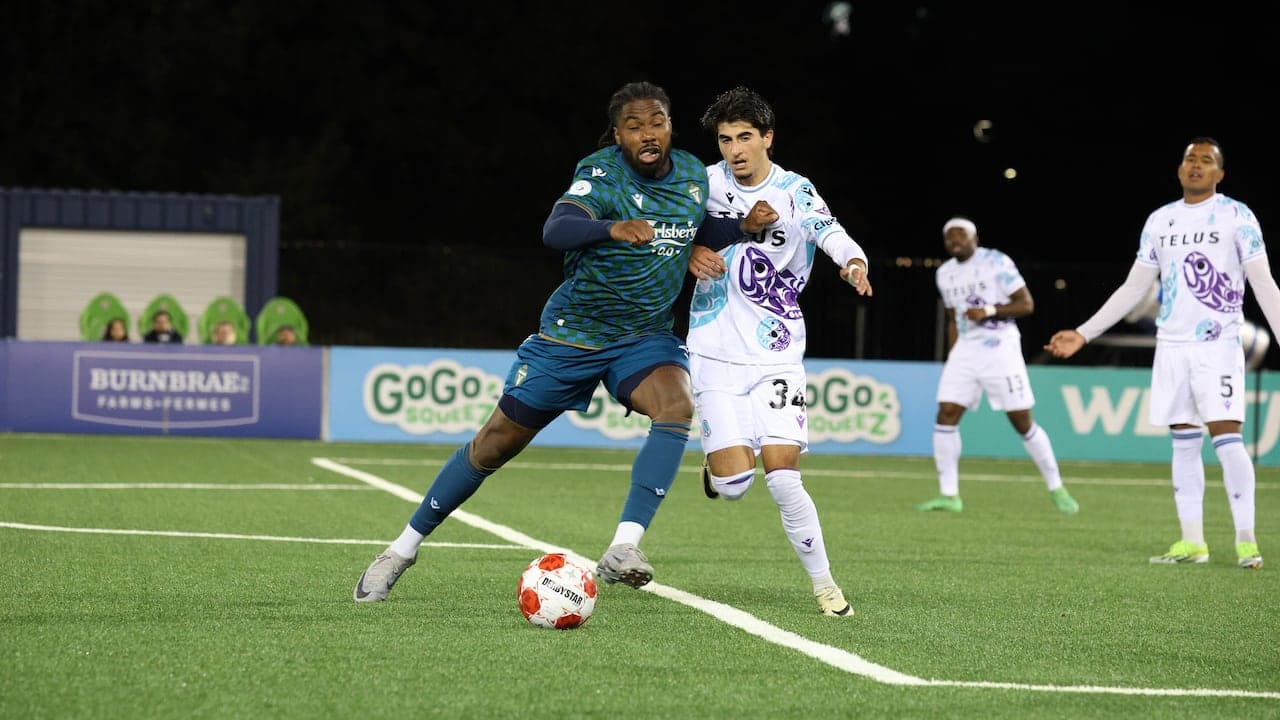 HFX Wanderers FC player dribbling against York United HFX Wanderers FC player dribbling against York United