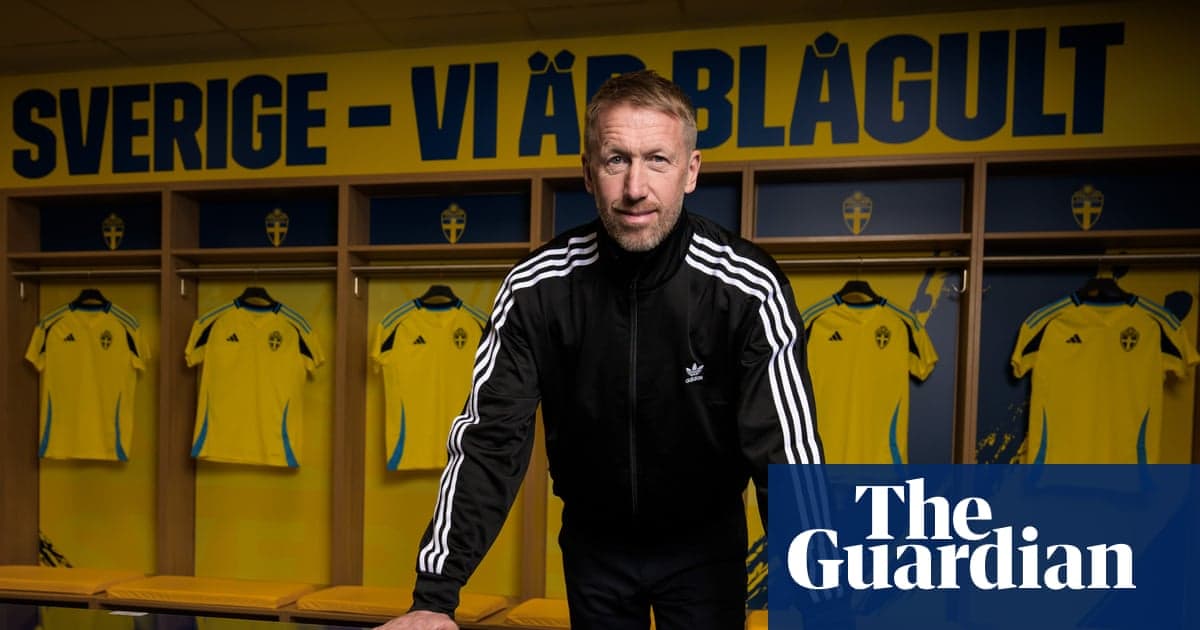 Coach standing in front of Swedish team jerseys Coach standing in front of Swedish team jerseys