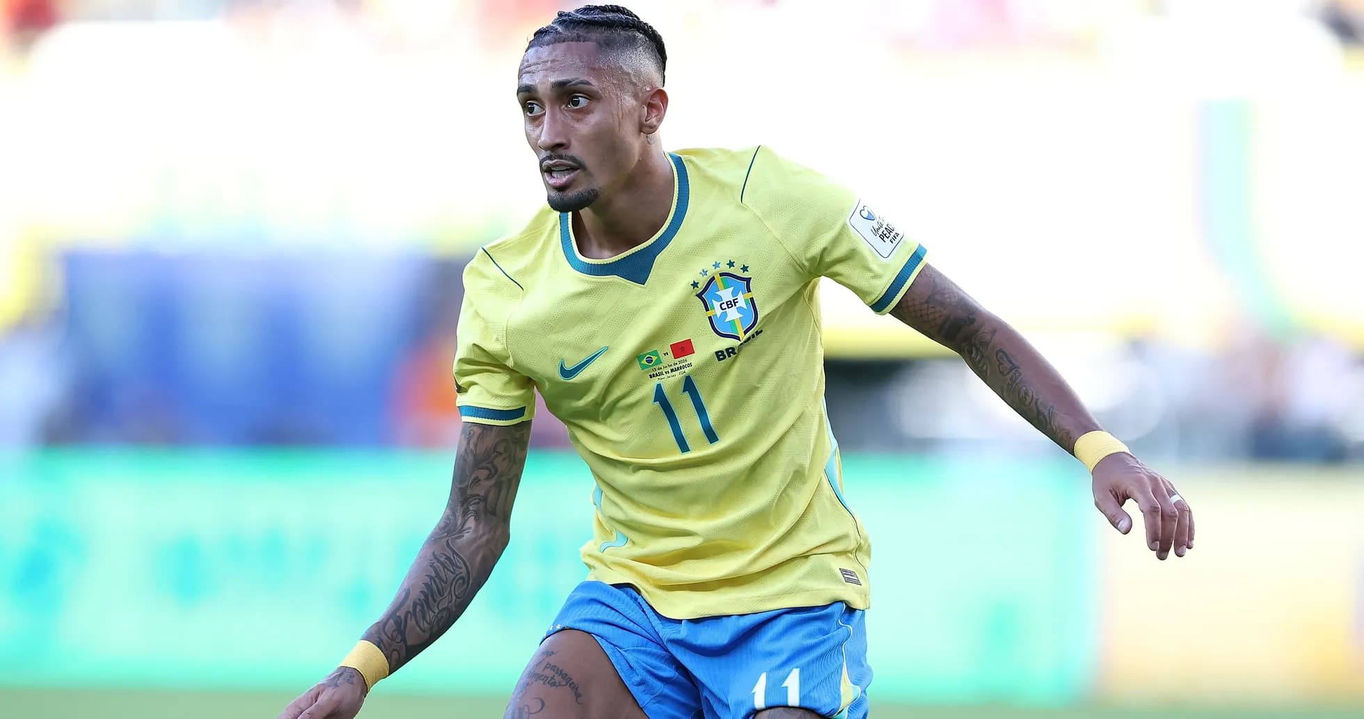 Player wearing Brazil jersey running on the field Player wearing Brazil jersey running on the field