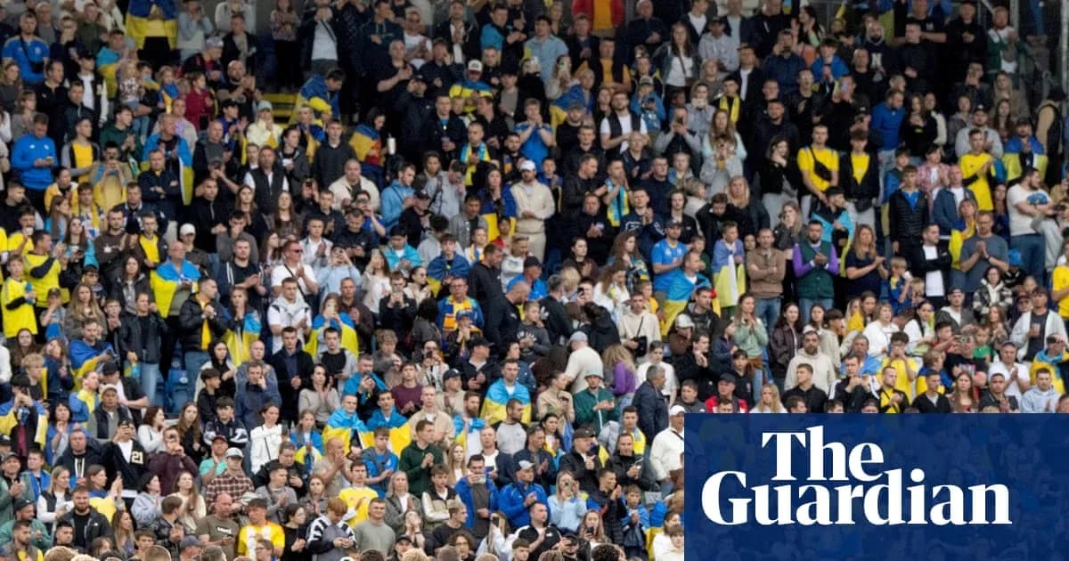 Crowd of fans in stadium with yellow and blue attire Crowd of fans in stadium with yellow and blue attire
