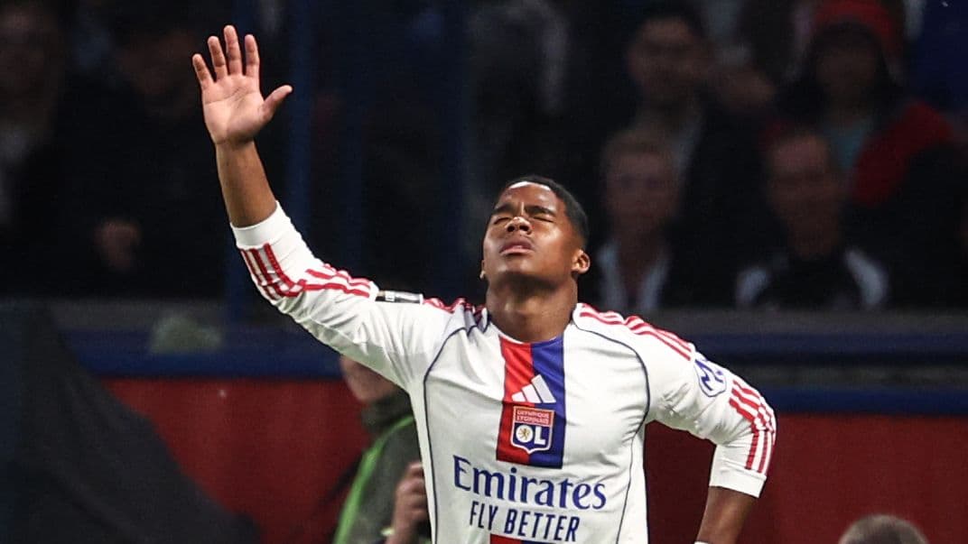 Player celebrating after scoring a goal for Lyon Player celebrating after scoring a goal for Lyon