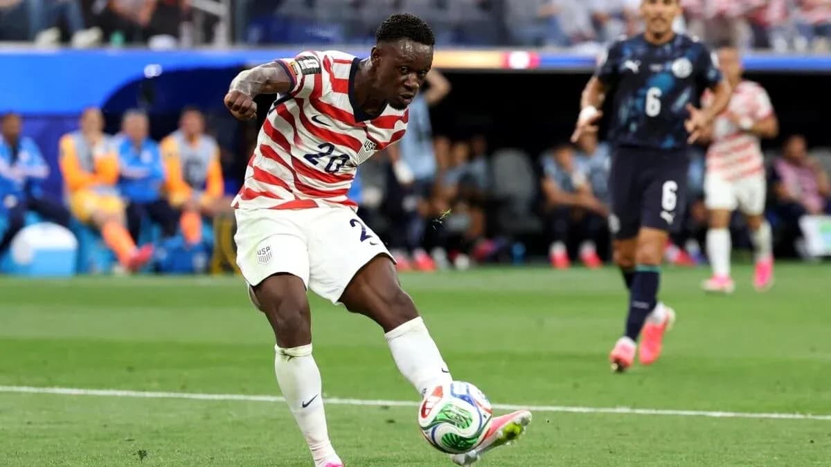 Player in striped jersey kicking soccer ball during match Player in striped jersey kicking soccer ball during match