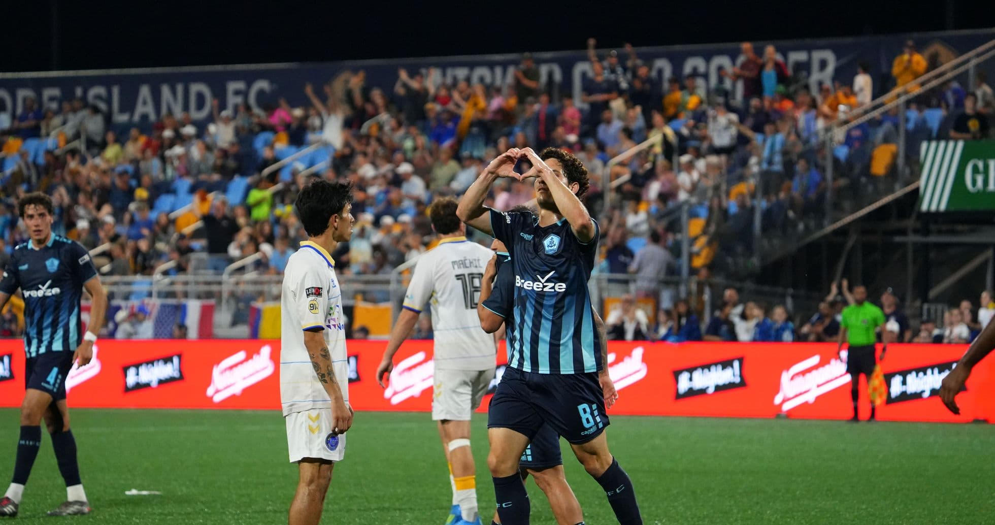Player celebrating after scoring in USL match Player celebrating after scoring in USL match