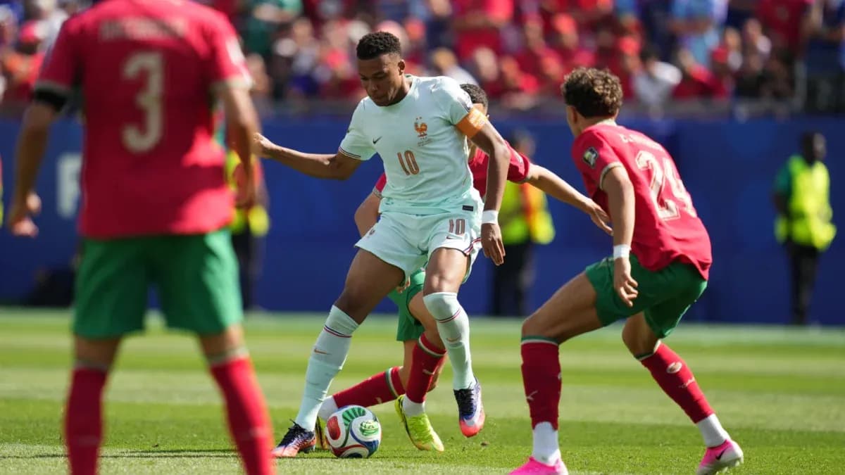 Player from France dribbling past Moroccan defenders Player from France dribbling past Moroccan defenders