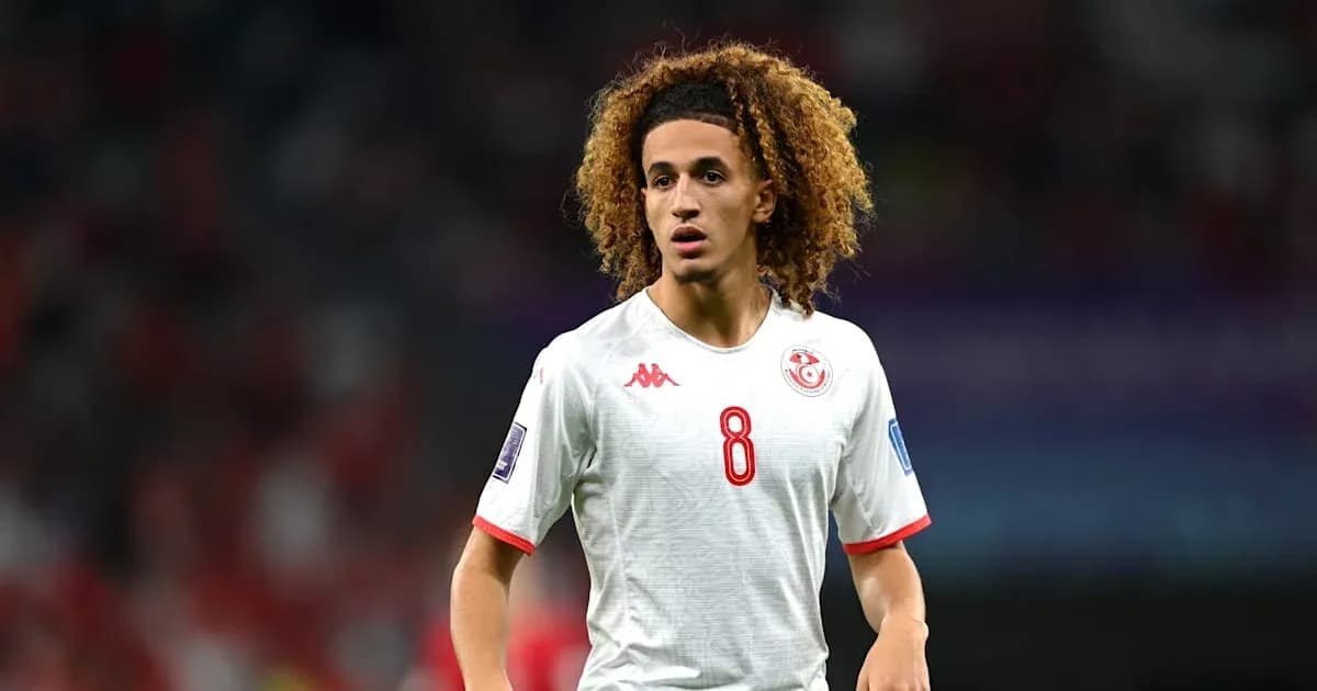 Player wearing Tunisia jersey during a match Player wearing Tunisia jersey during a match
