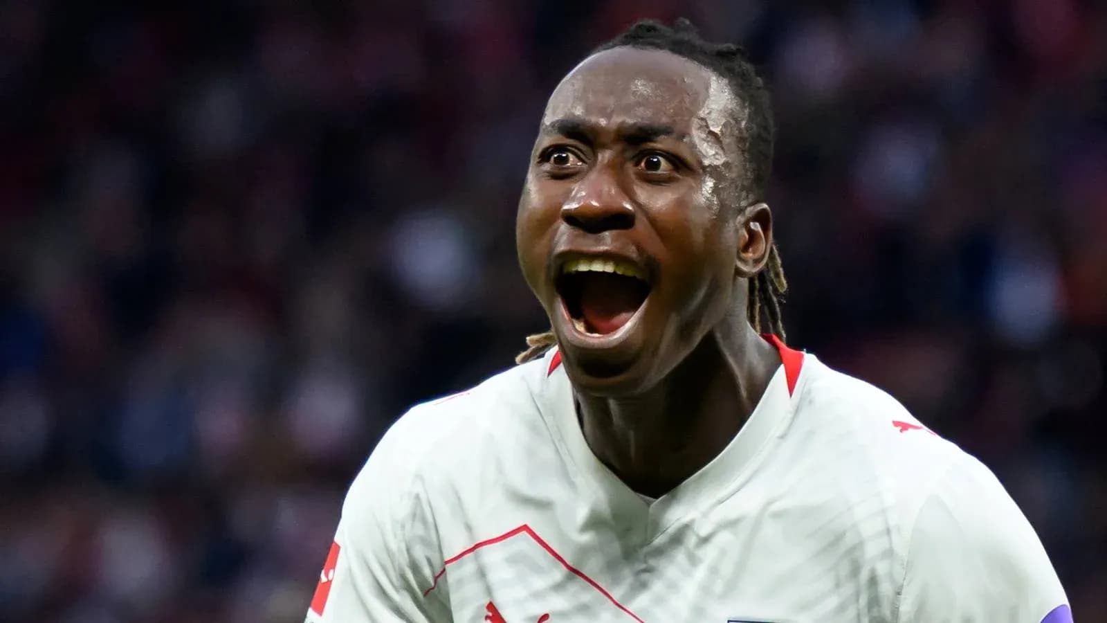 Player celebrating passionately after scoring a goal Player celebrating passionately after scoring a goal