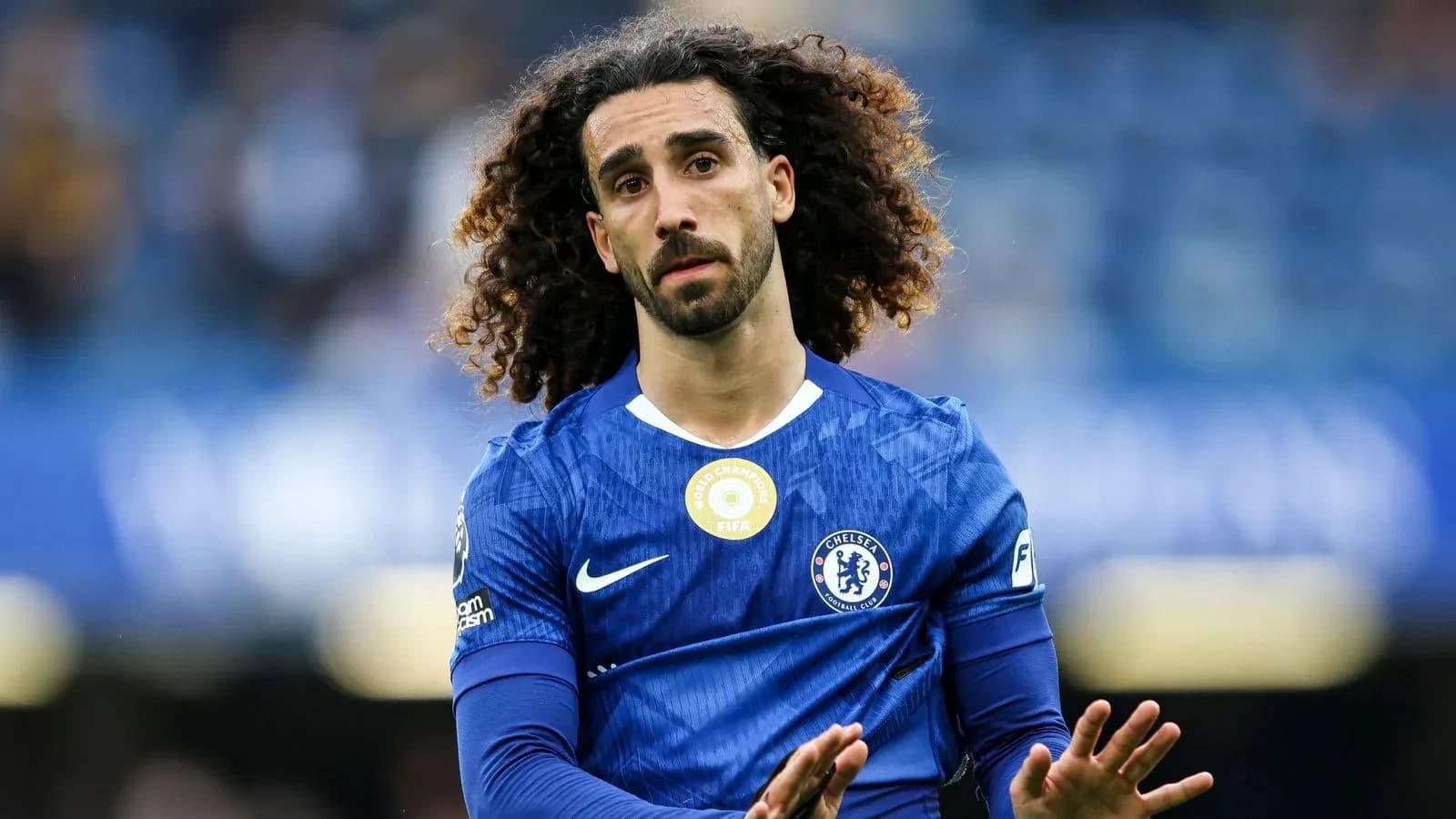 Chelsea player walking on the pitch in blue kit Chelsea player walking on the pitch in blue kit