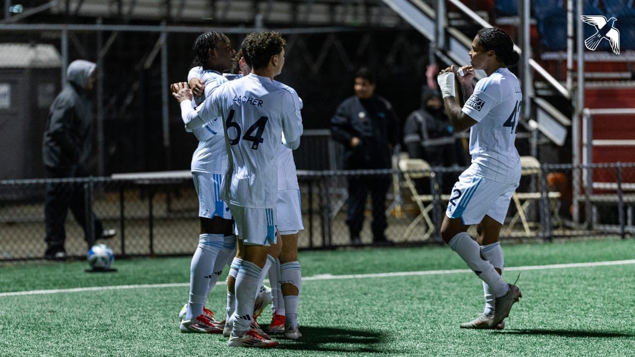Players celebrating a goal during match Players celebrating a goal during match