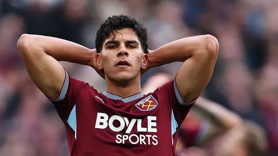 Player with hands on head in team jersey Player with hands on head in team jersey