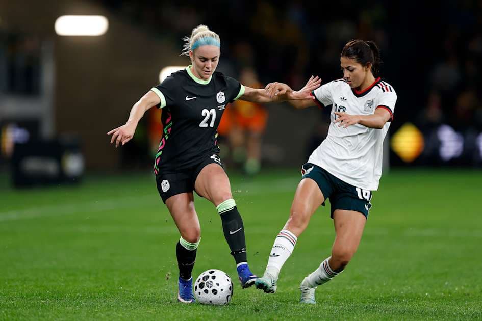 Two players competing for the ball during match Two players competing for the ball during match