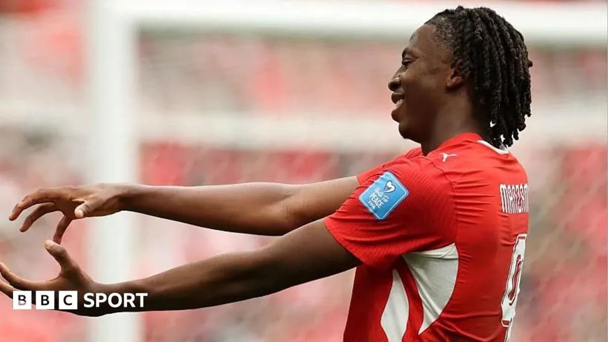 Player celebrating a goal on the pitch Player celebrating a goal on the pitch