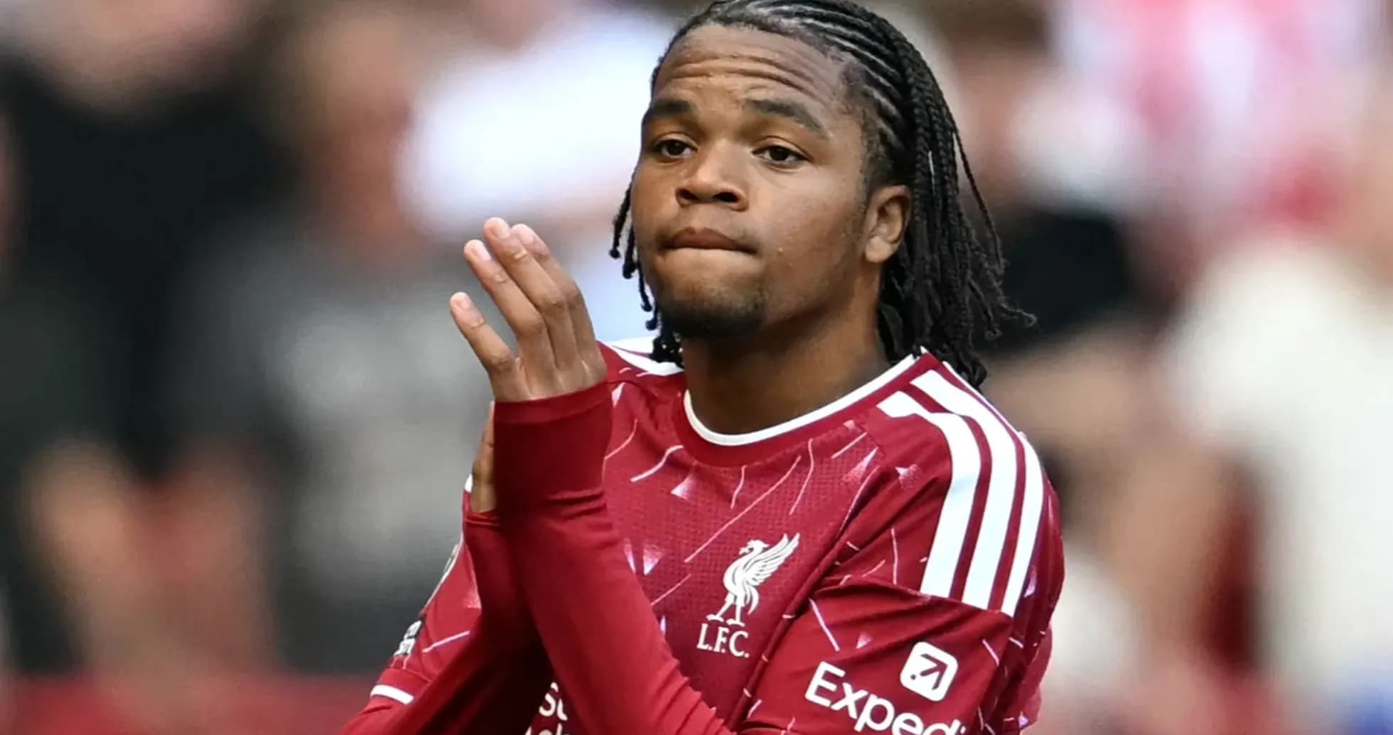 Player in Liverpool kit applauding fans at match Player in Liverpool kit applauding fans at match