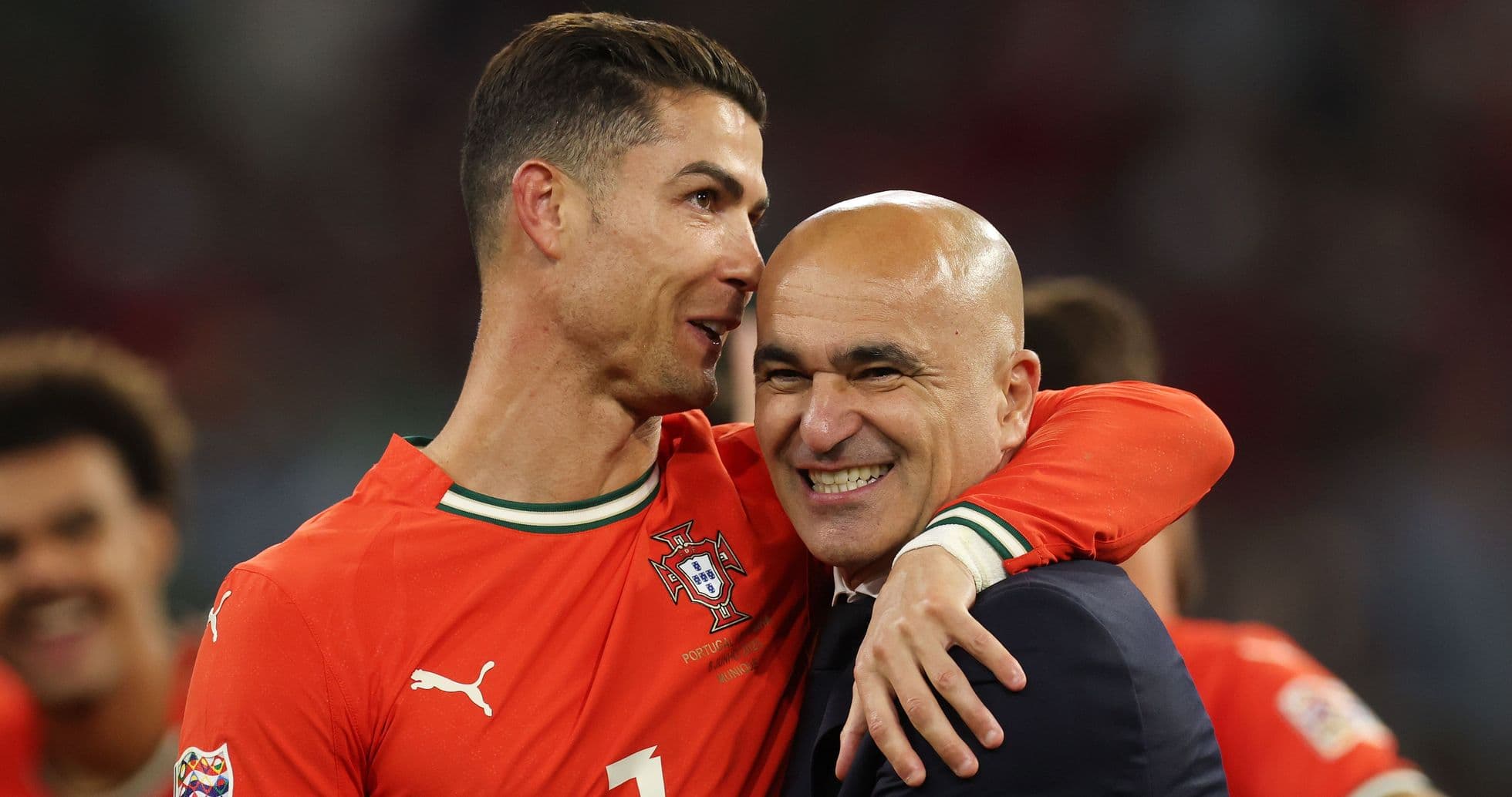 Cristiano Ronaldo embracing coach Roberto Martínez after match Cristiano Ronaldo embracing coach Roberto Martínez after match
