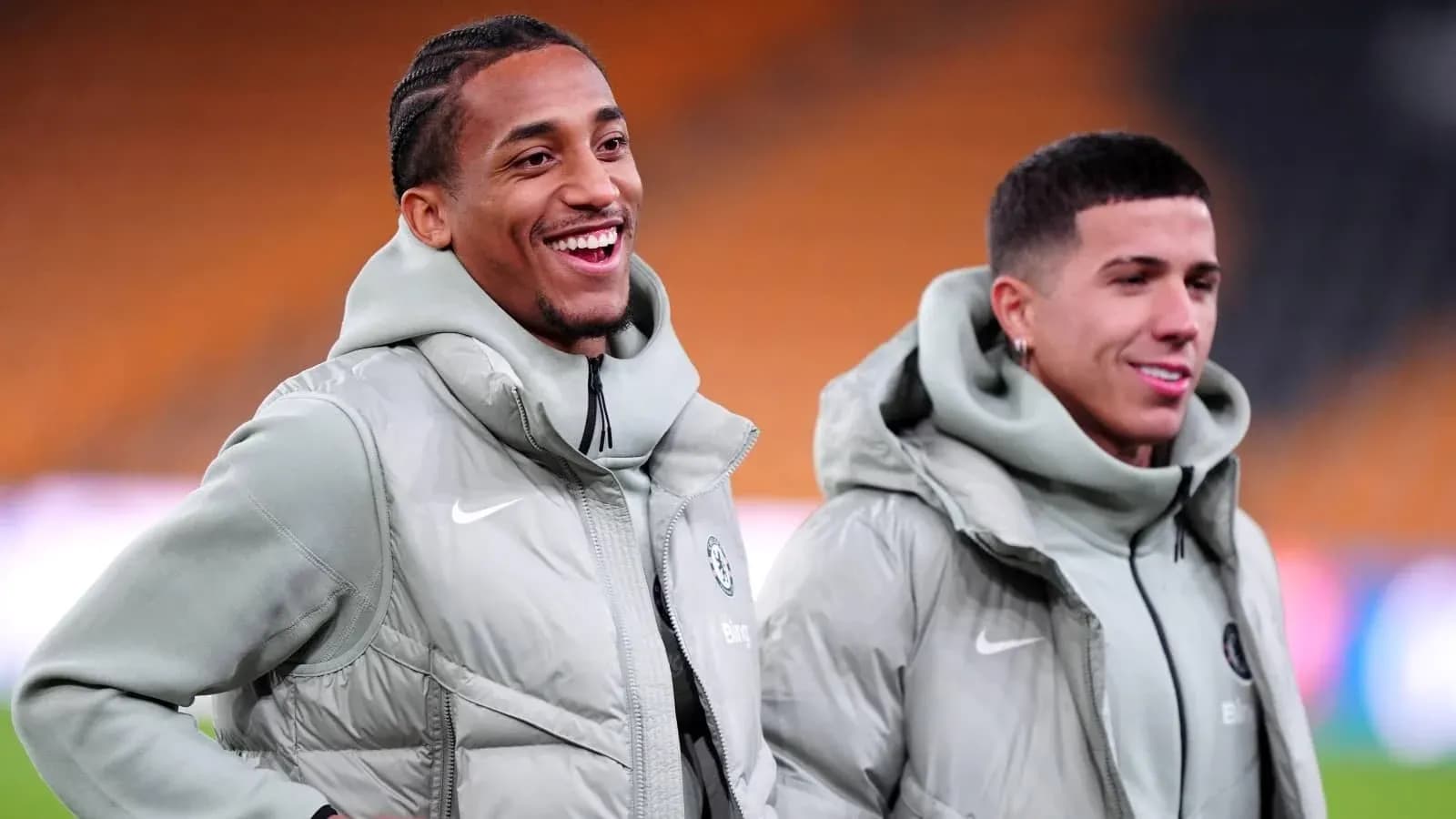 Two players smiling during warm-up before match Two players smiling during warm-up before match