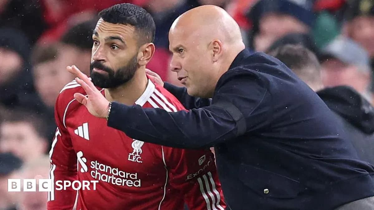 Player receiving instructions from coach on sidelines Player receiving instructions from coach on sidelines