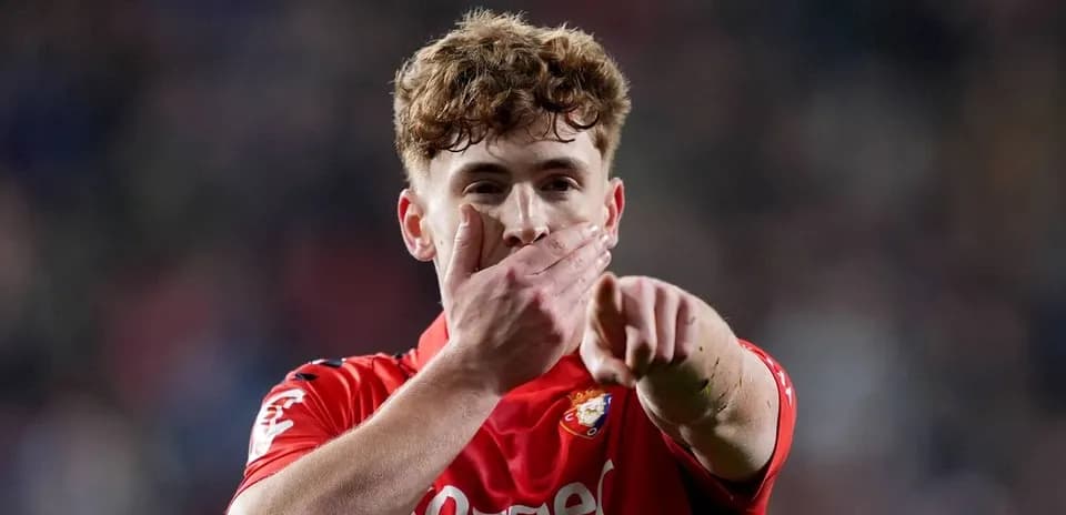 Player celebrating and pointing during match Player celebrating and pointing during match