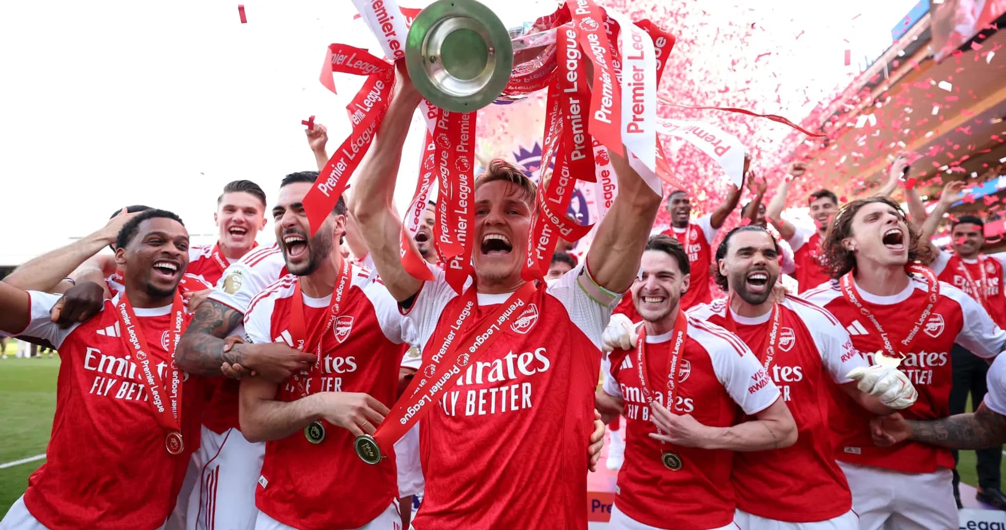 Arsenal players celebrating Premier League trophy victory Arsenal players celebrating Premier League trophy victory