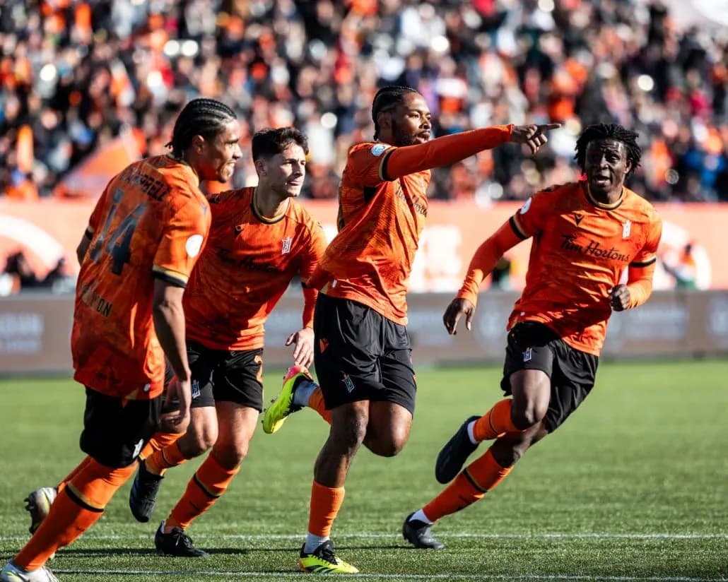 Players celebrating a goal during Forge match Players celebrating a goal during Forge match