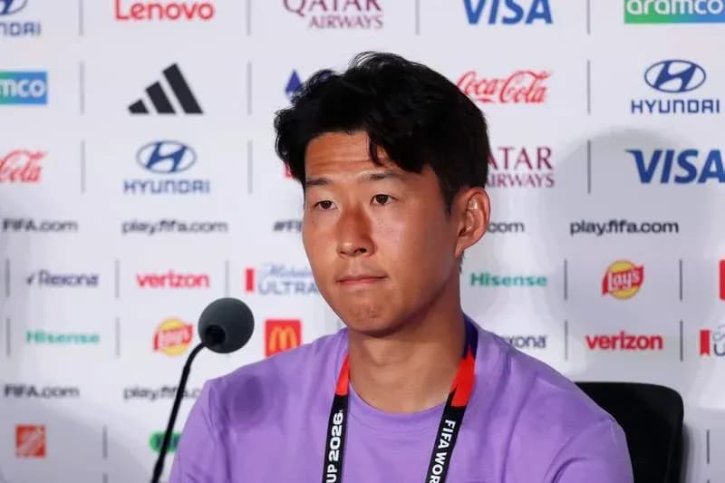 Player speaking at press conference with sponsor logos Player speaking at press conference with sponsor logos