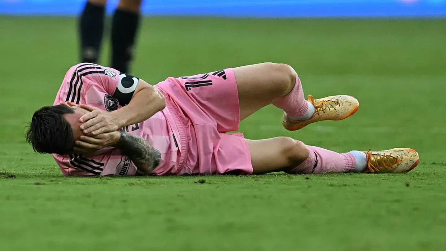 Player on the ground, holding face in distress Player on the ground, holding face in distress