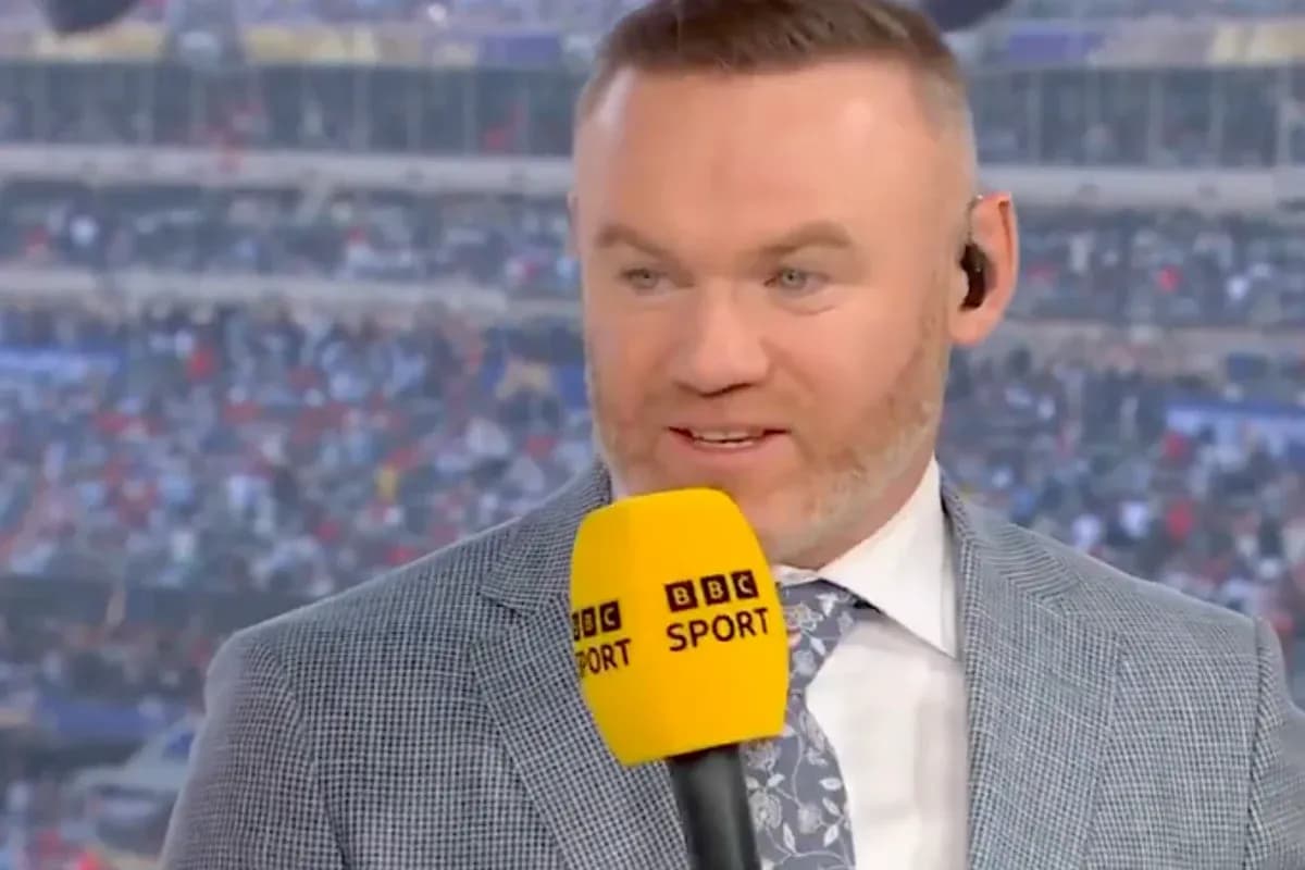 Sports commentator speaking with microphone on set Sports commentator speaking with microphone on set